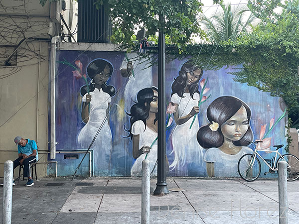 Man resting by mural